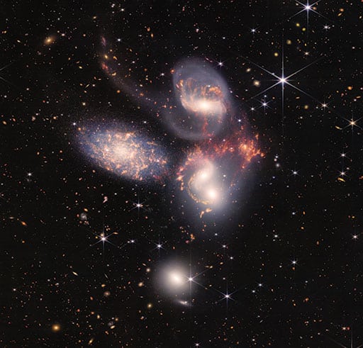 Webb’s view of this compact group of galaxies, Stephan’s Quintet, located in the constellation Pegasus, pierced through the shroud of dust surrounding the center of one galaxy, to reveal the velocity and composition of the gas near its supermassive black hole. Now, scientists can get a rare look, in unprecedented detail, at how interacting galaxies are triggering star formation in each other and how the gas in these galaxies is being disturbed.